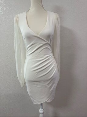 Elegant White Wrap-Style Dress with Sheer Dot Sleeve
